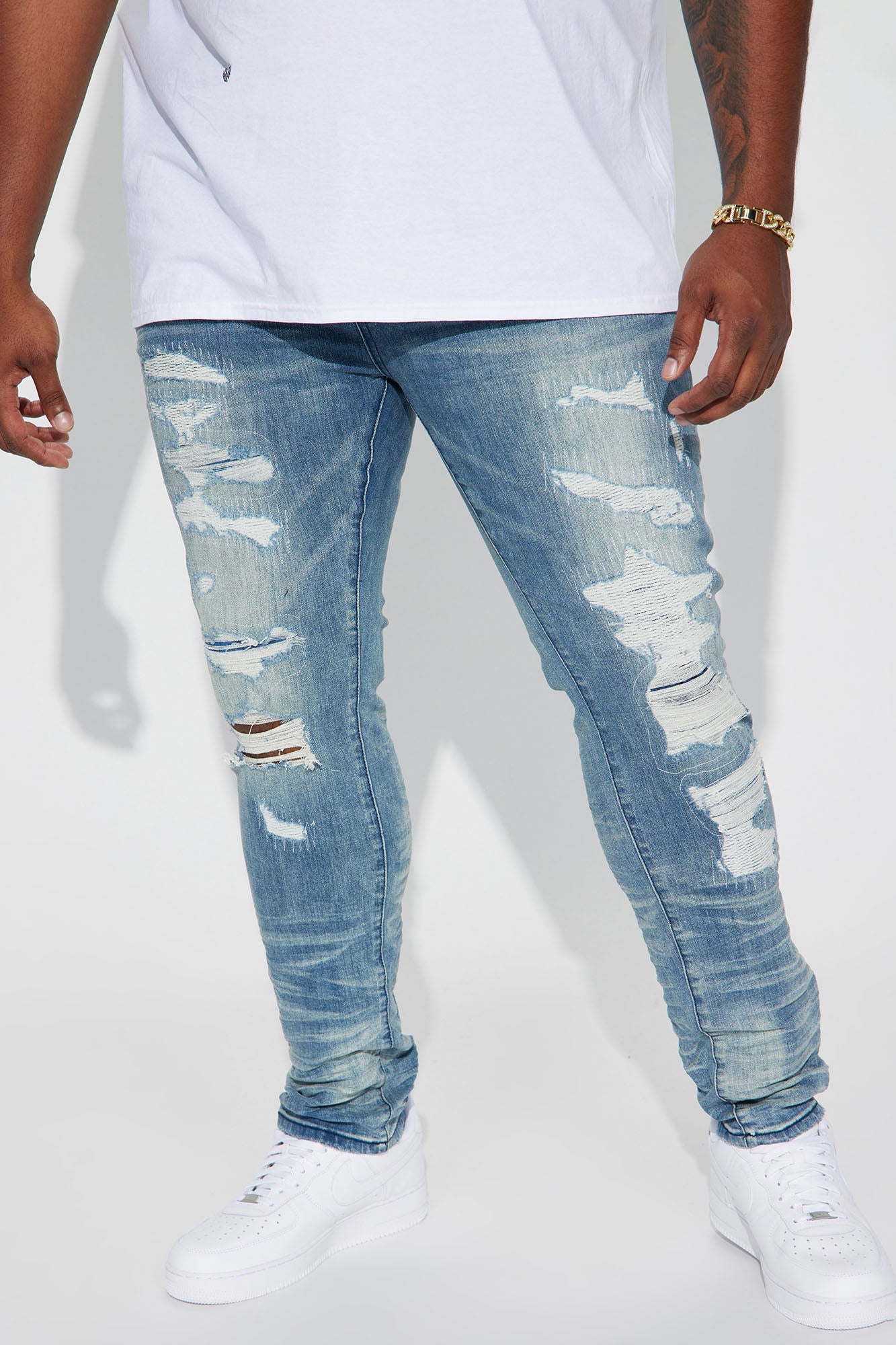 Fame Frenzy: Light Wash Paint-Spotted Stacked Skinny Jeans
