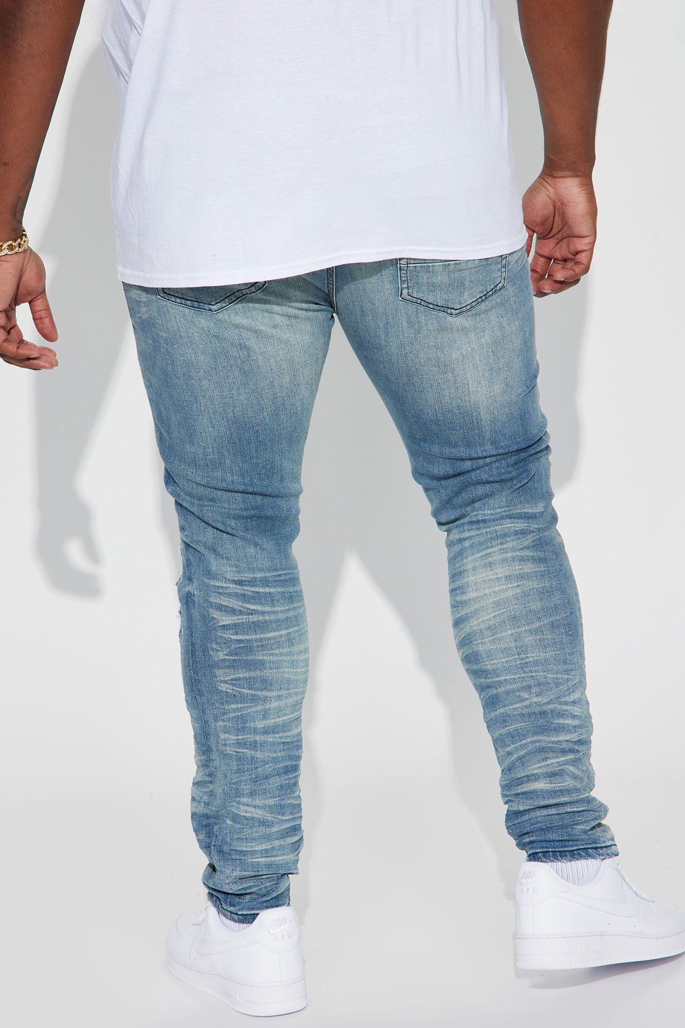 Fame Frenzy: Light Wash Paint-Spotted Stacked Skinny Jeans