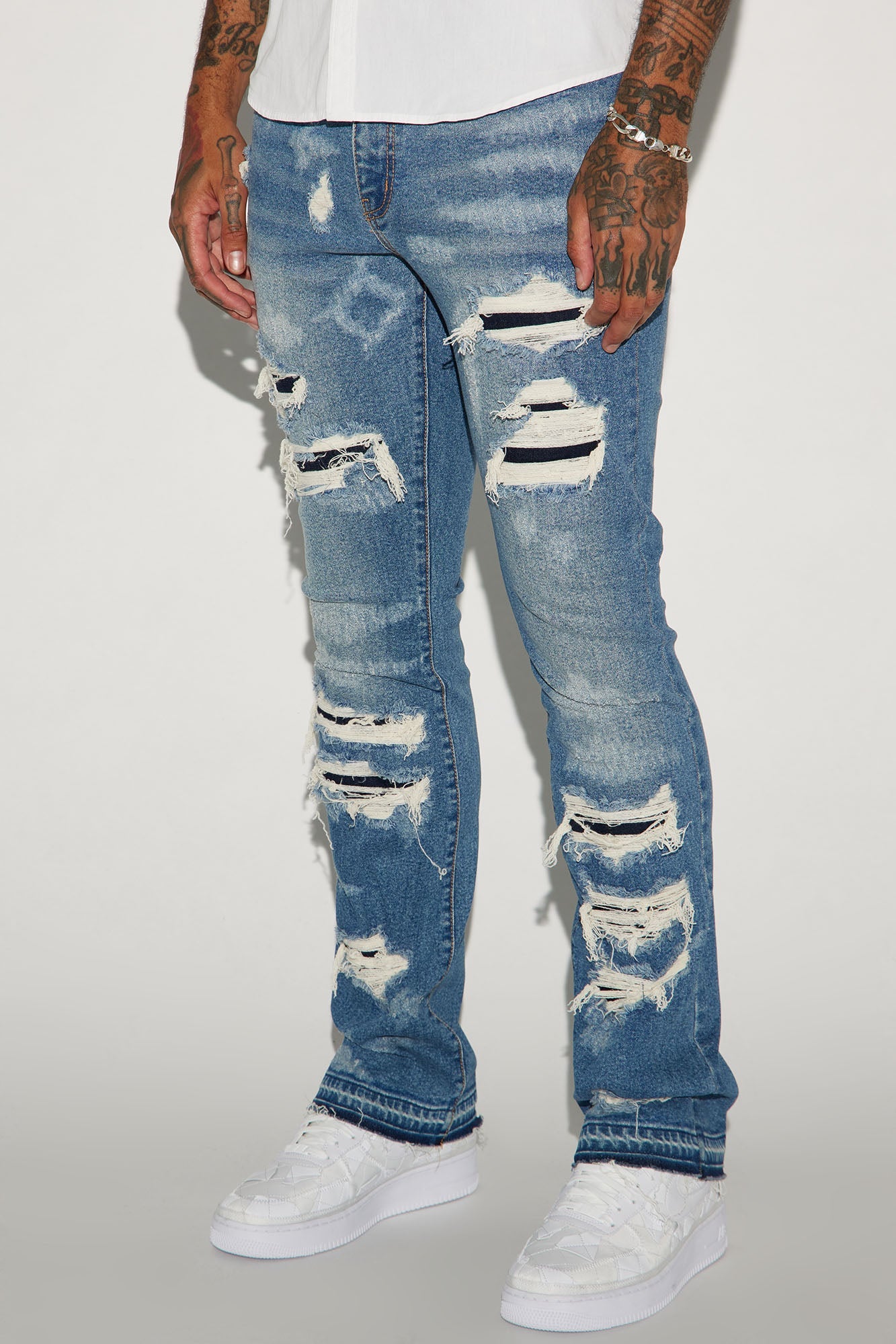 Get Cuffed in Style: Medium Wash Stacked Skinny Flared Jeans