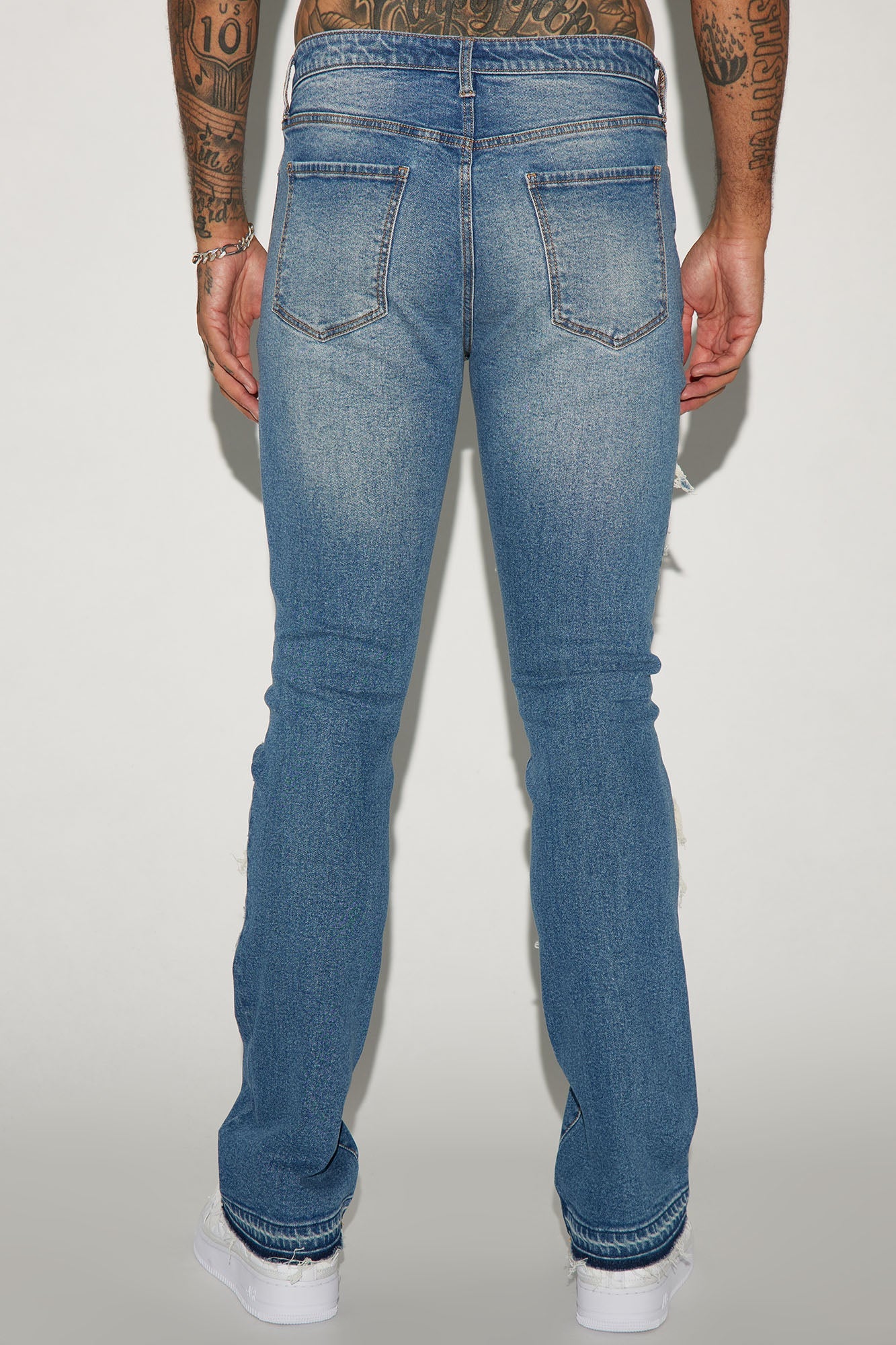 Get Cuffed in Style: Medium Wash Stacked Skinny Flared Jeans