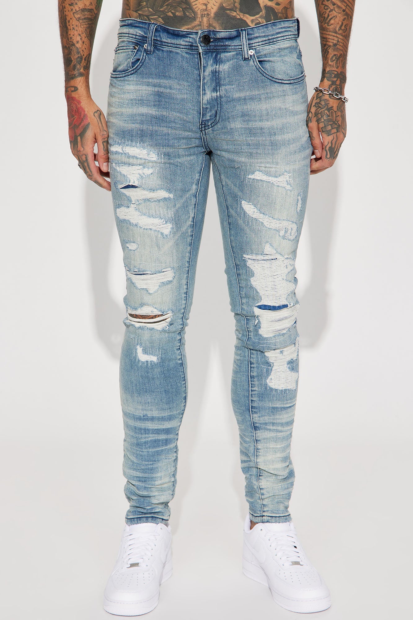 Fame Frenzy: Light Wash Paint-Spotted Stacked Skinny Jeans
